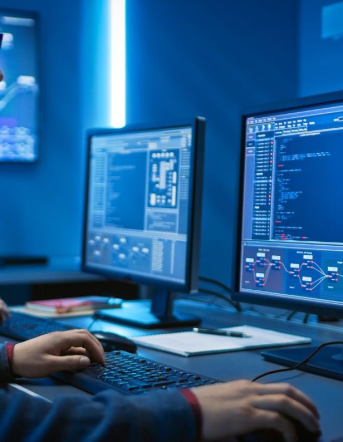 guy looking at computer screens.